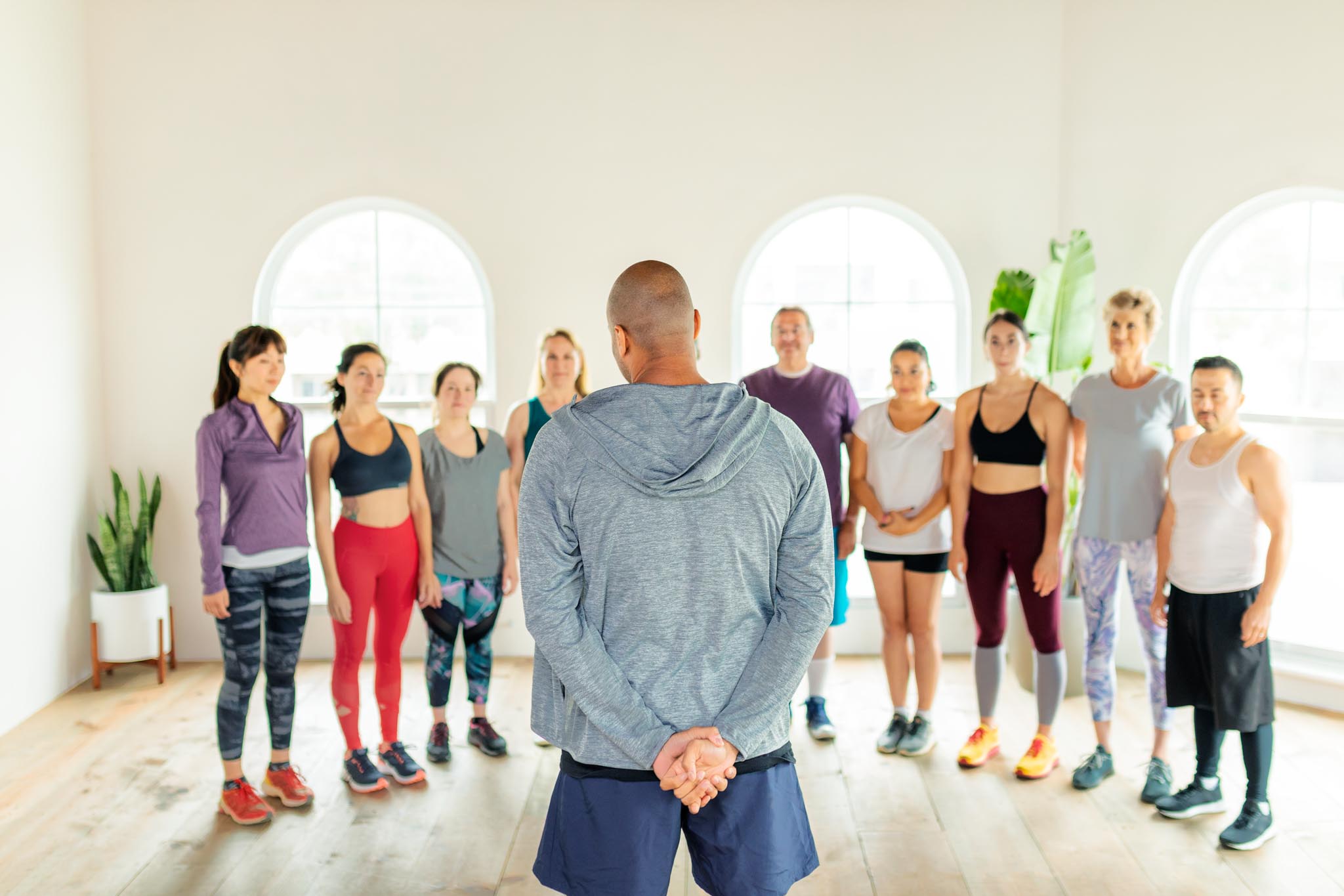 Trainer and his students in a gym