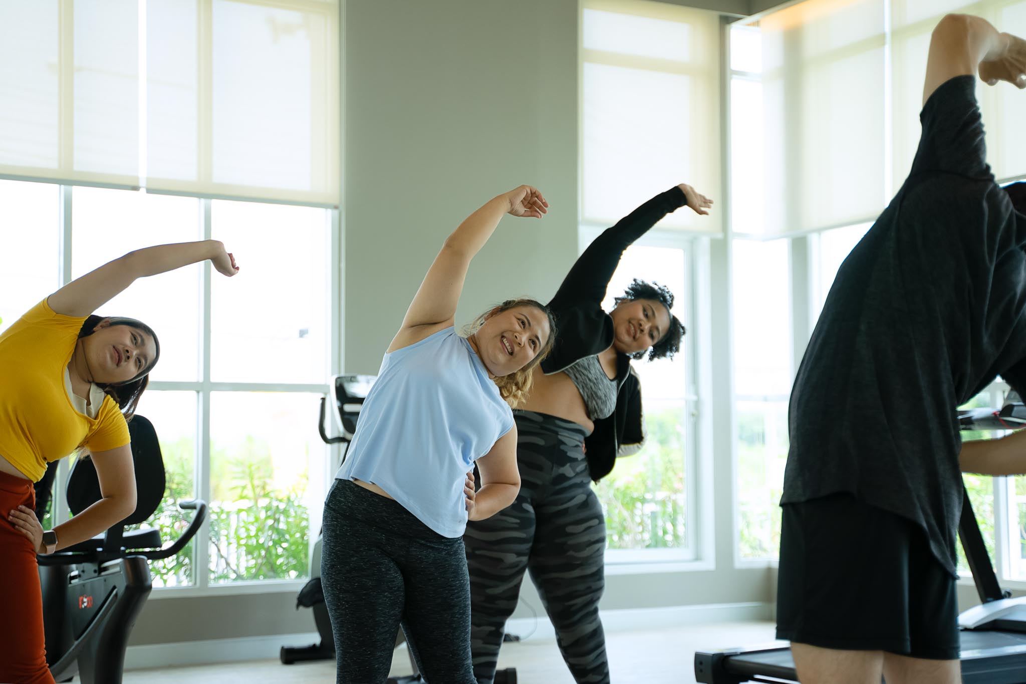 Plus size women workout at fitness center. Health care and lifestyle.